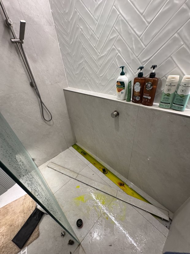Dye test locating a shower leak