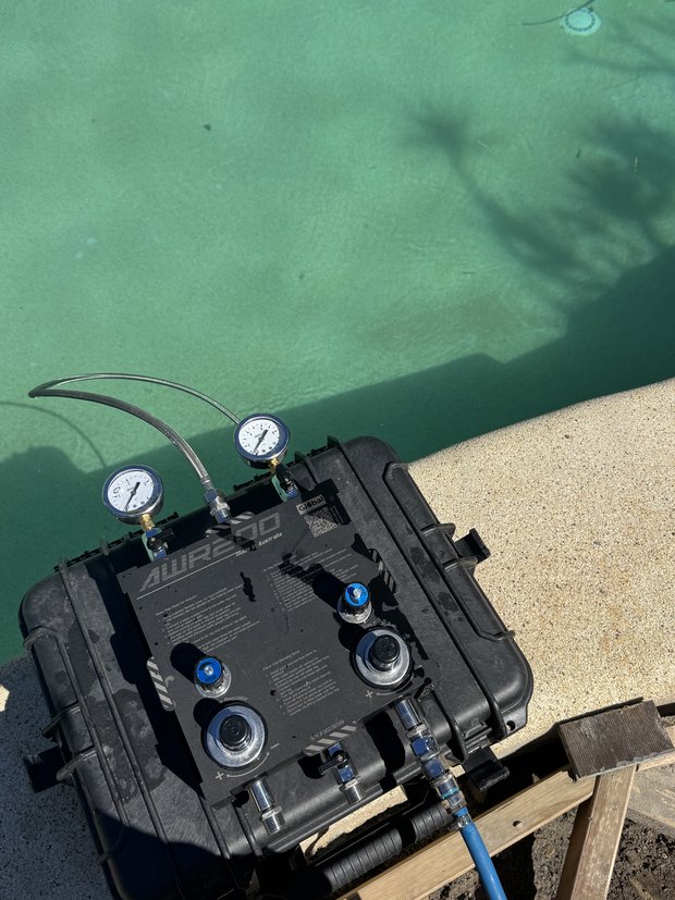 Pressure and tracer gas rig set up at a pool