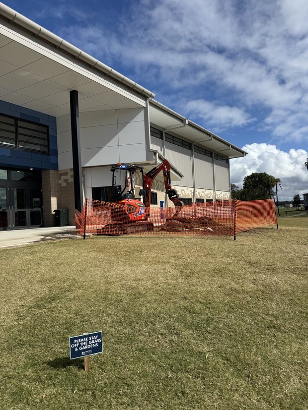 Excavator fenced off on a commercial leak repair