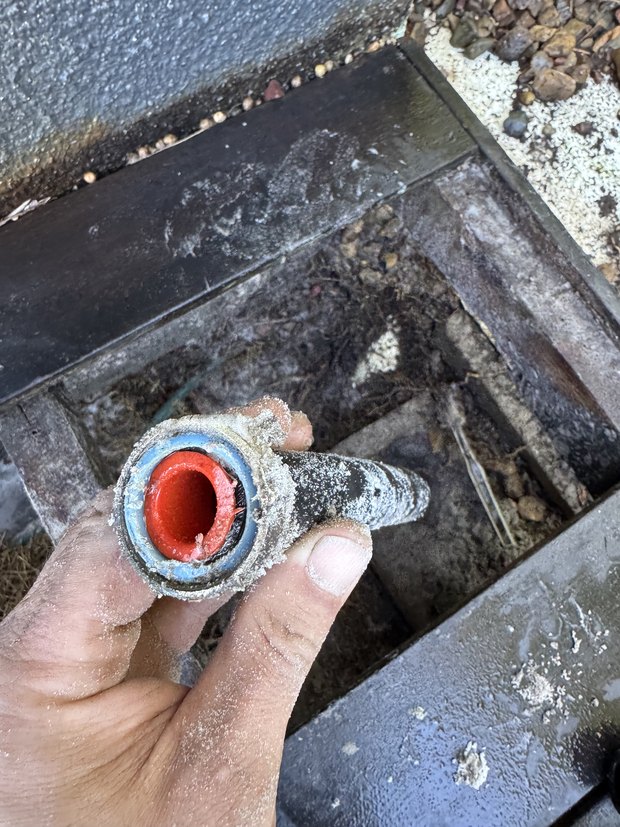 Section of failed pipe cut out of the ground