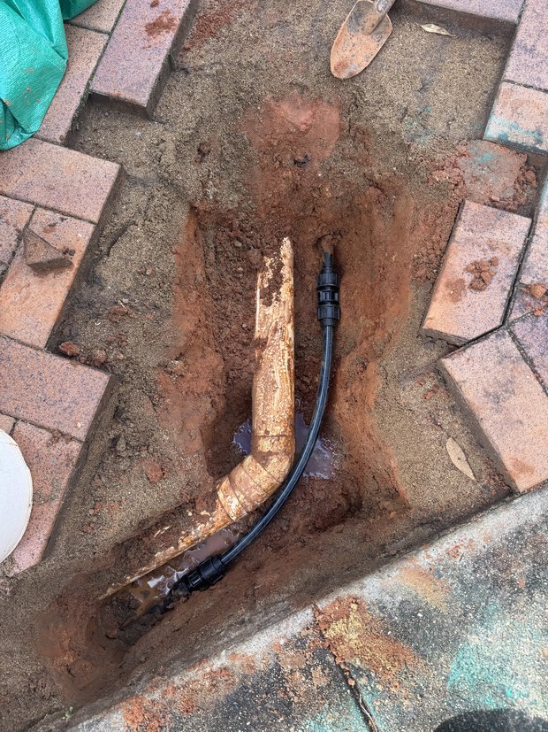 Burst pipe cut out and replaced under pavers