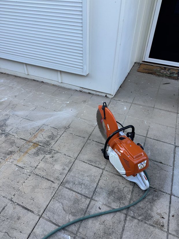 Concrete saw ready to cut in to a slab leak