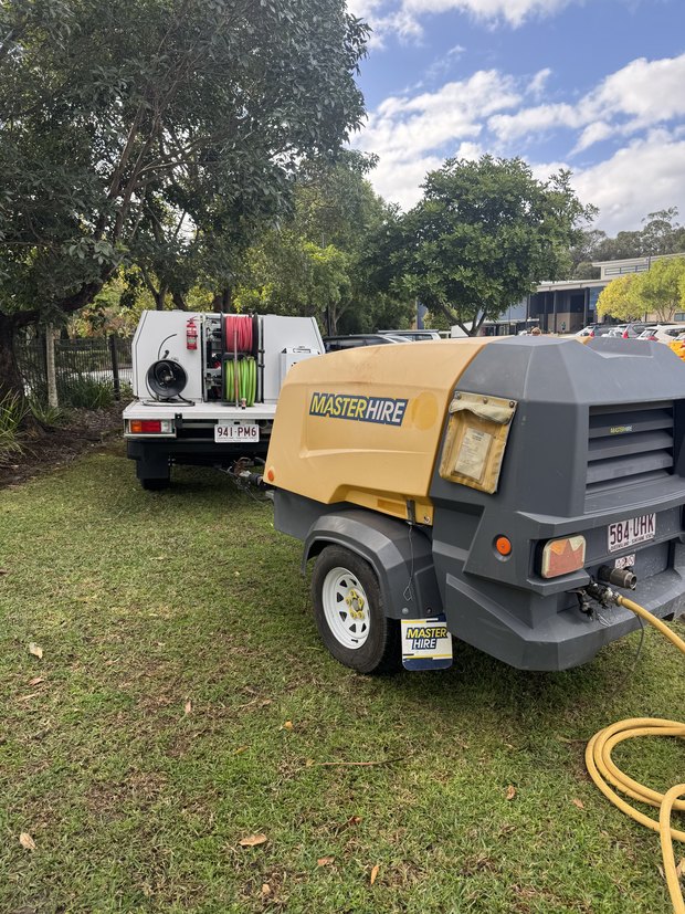 Compressor on site beside the ute for a commercial job