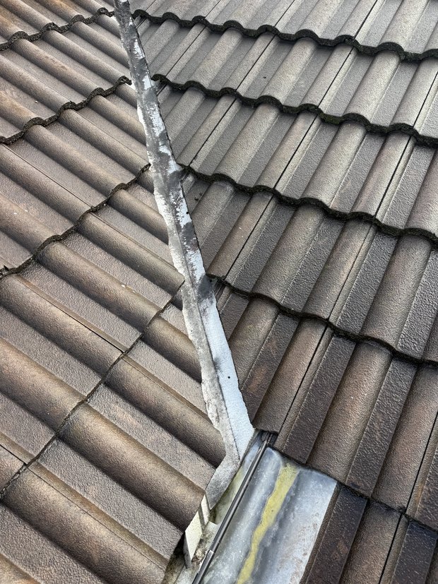 Roof valley inspected for a ceiling leak