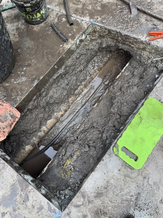 Concrete cut out and water service repaired