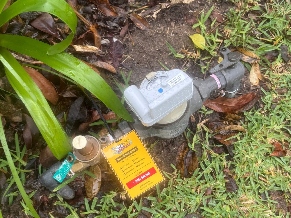 Water meter with a Got A Leak tag attached after a leak inspection