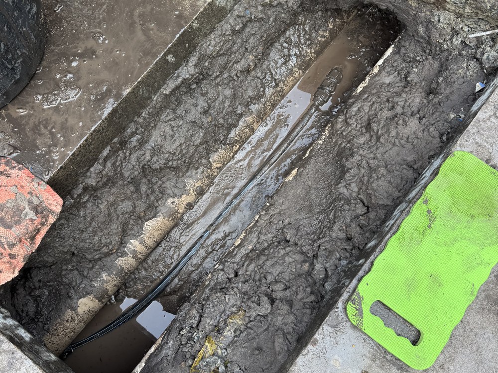 Concrete cut out to reach and repair a leaking water main