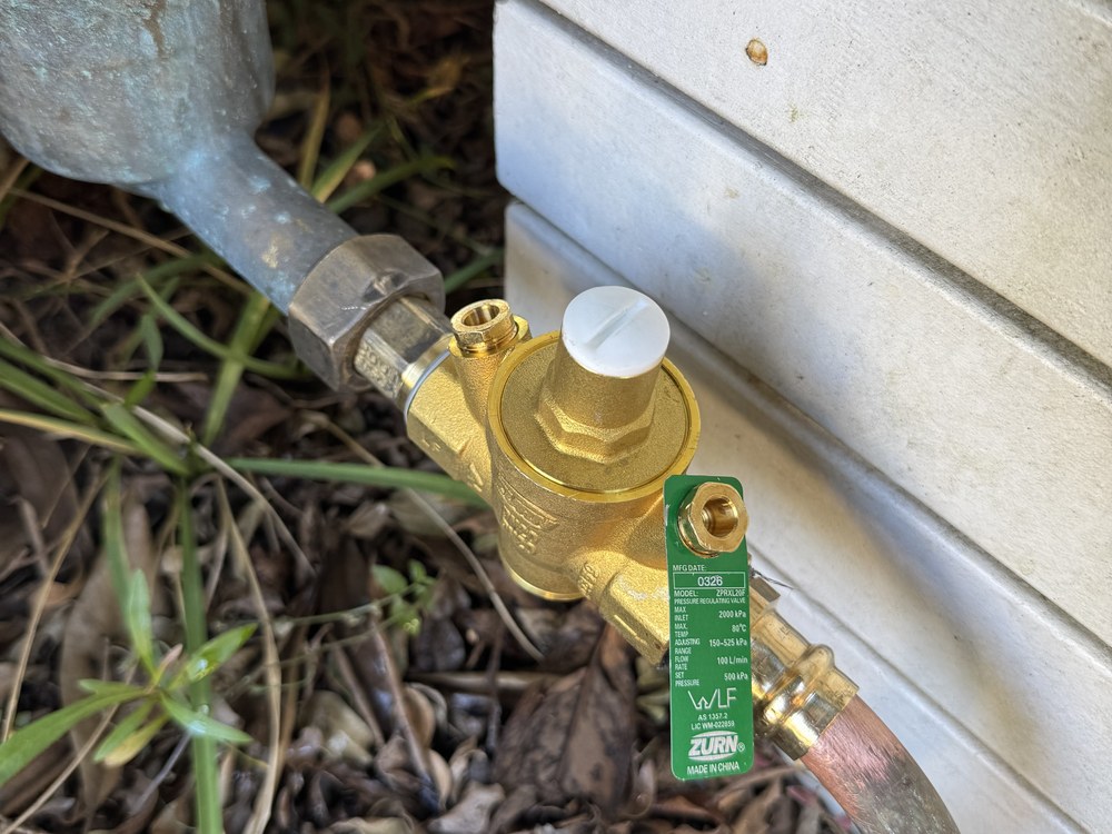 Water meter and pressure limiting valve at a Sunshine Coast property